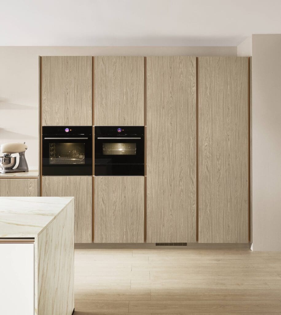 Handleless kitchen with vertical channel handle | MHK Kitchen Experts